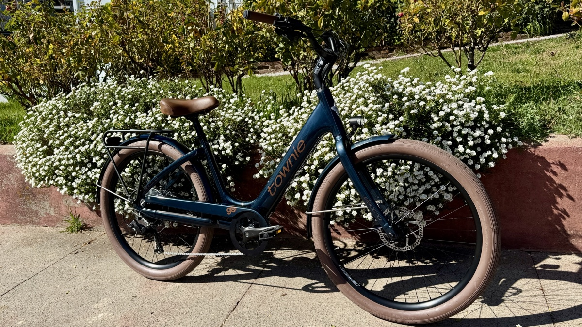 Rider on an Electra with both feet planted flat on the ground